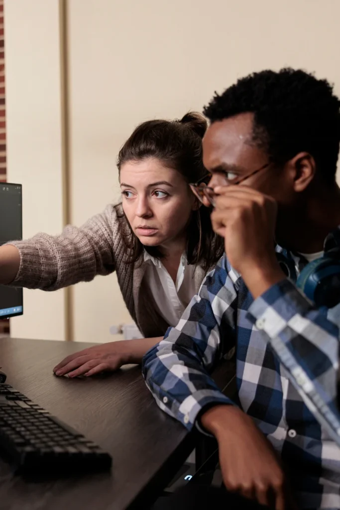 data breach recovery_ man and woman looking at computer