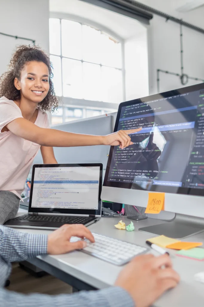 woman pointing at computer screen