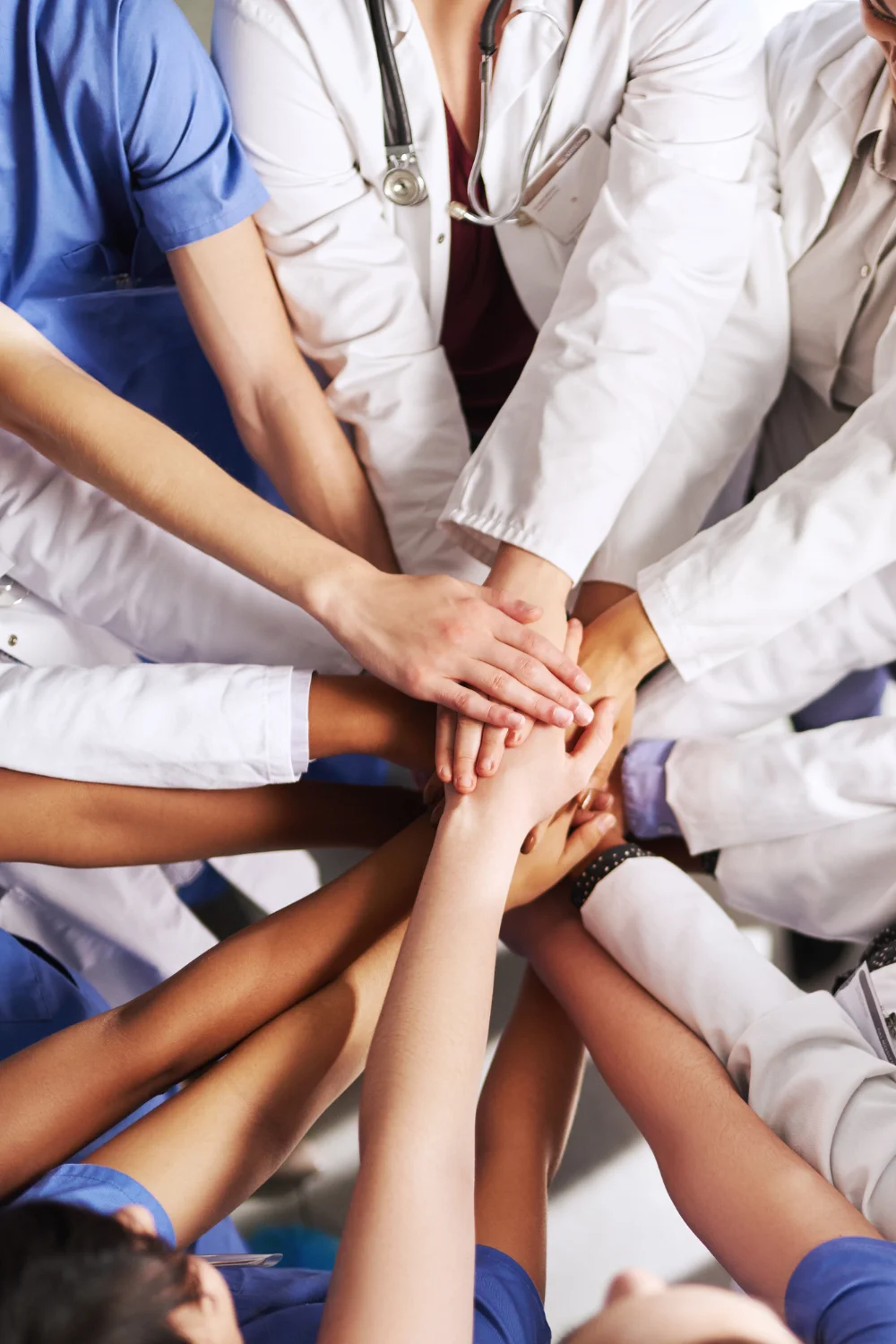 genai healthcare hands together