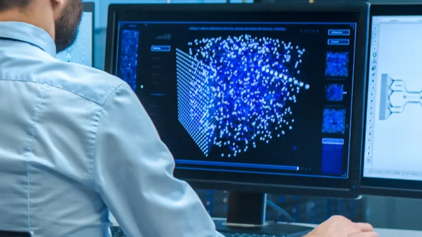 person on computer in blue office